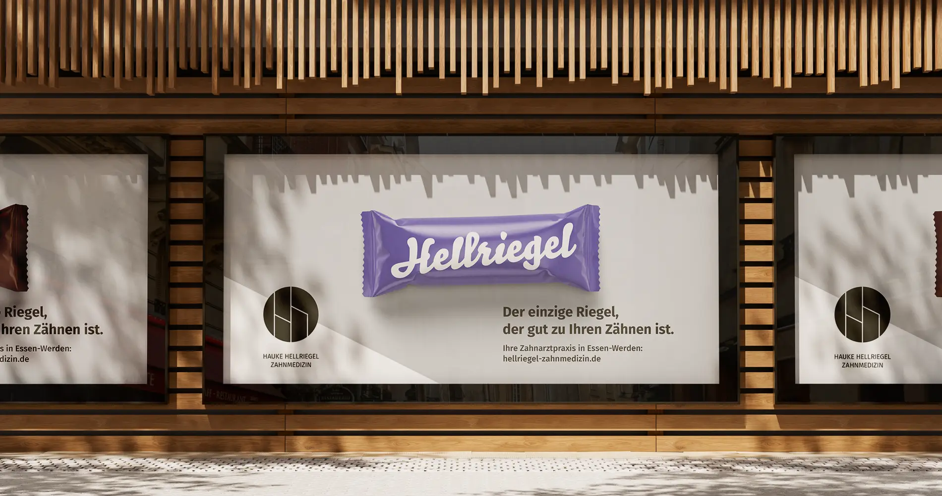 Außenwerbung einer Zahnarztpraxis mit humorvollem Riegel-Motiv als Teil der Markenkommunikation
