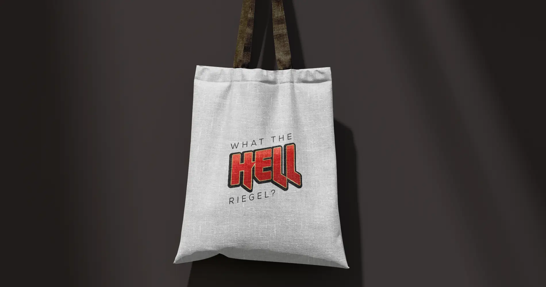 Stofftasche mit provokantem Typografie-Statement als Teil eines eigenständigen Praxisbrandings