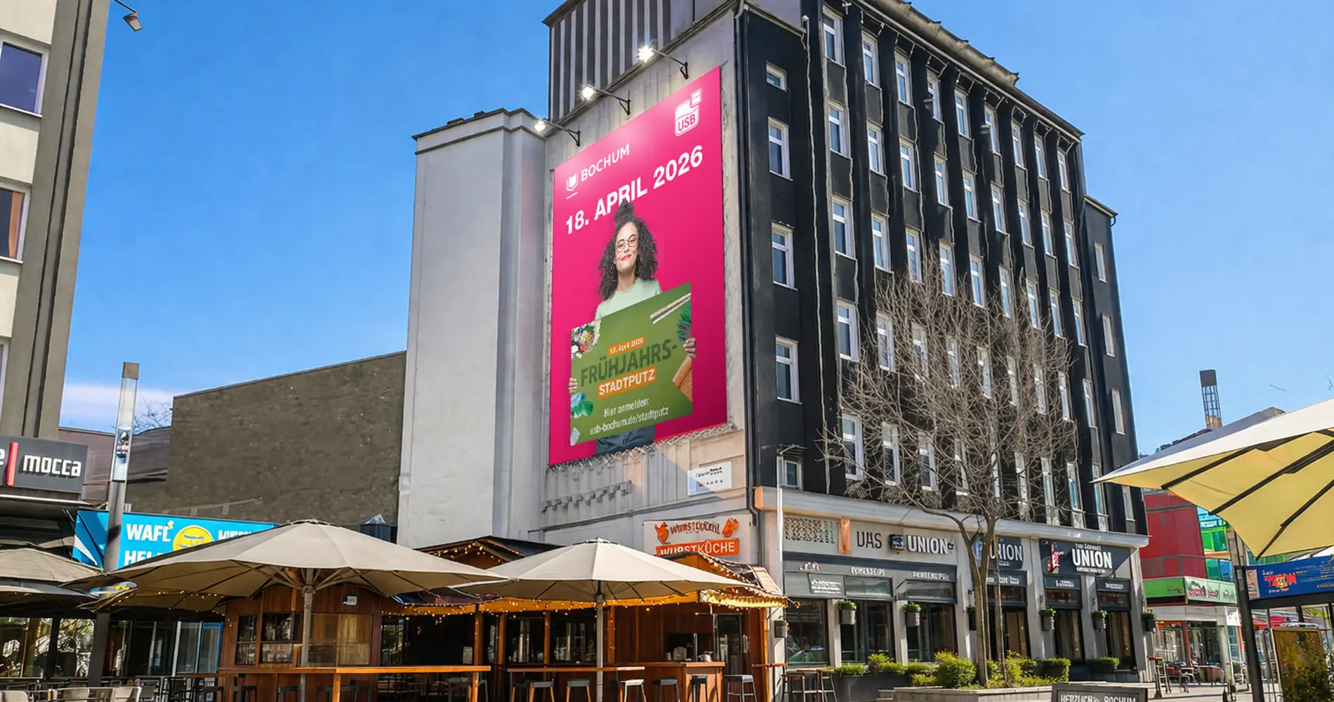 USB Frühjahrs-Stadtputz Bochum 2026 Großflächenplakat am Bermuda3Eck in der Bochumer Innenstadt