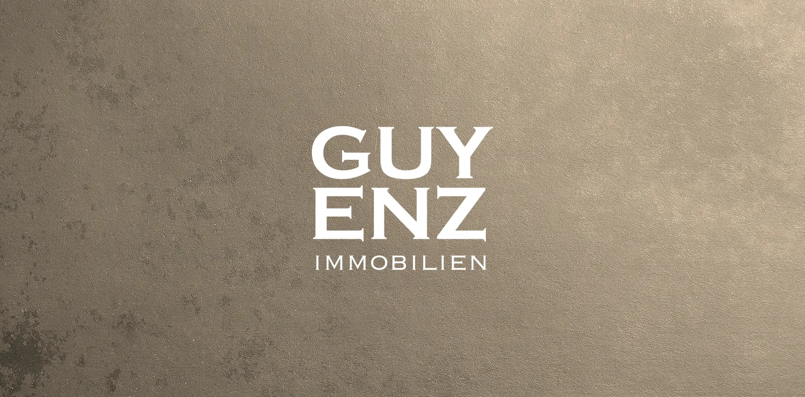 Logo von Guyenz Immobilien in weiß auf neutralem Hintergrund